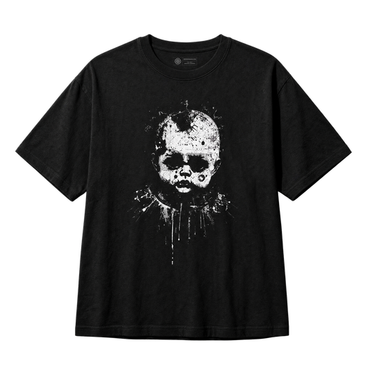 A black short-sleeve crewneck t-shirt featuring a distressed white graphic print of a creepy doll-like character on the front, displayed against a solid white background.