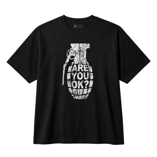 A black short-sleeve crewneck t-shirt featuring a distressed white graphic of a hand grenade with the text 'ARE YOU OK?' printed on the front, displayed against a clean white background.